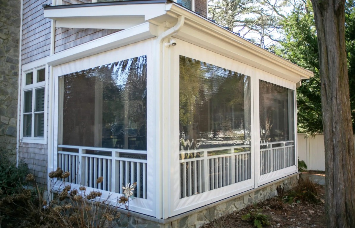 Three-season sunroom with white frames in Fort Lauderdale